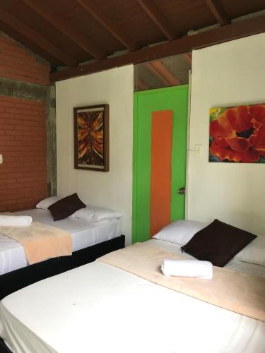 Cama o camas de una habitación en Eco Hotel Green Eden