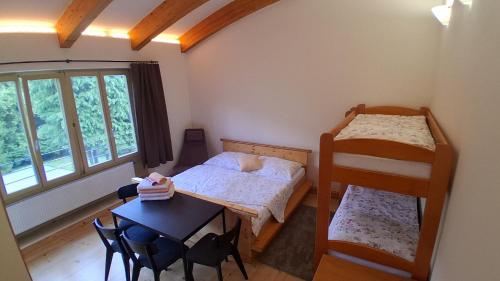 Postel nebo postele na pokoji v ubytování Apartmány U Libuše