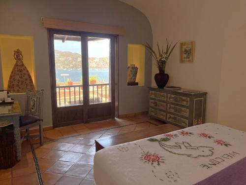 Ένα ή περισσότερα κρεβάτια σε δωμάτιο στο La Casa Que Canta