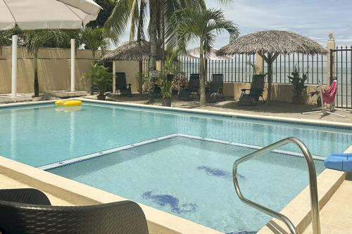 a large swimming pool with a yellow frisbee in it at Brisas del Mar in Chumical
