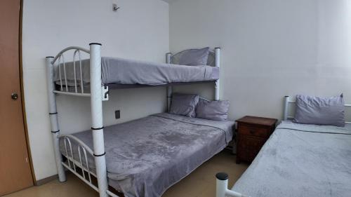 Postel nebo postele na pokoji v ubytování Hostal Ciudad de Mexico