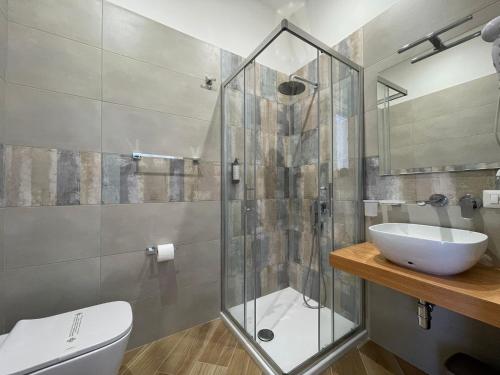 a bathroom with a glass shower and a sink at Relais Villa Verde in Ventotene