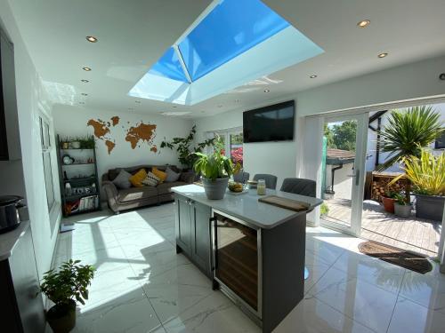 a large living room with a large skylight at Modern Room in Cardiff, Wales in Cardiff