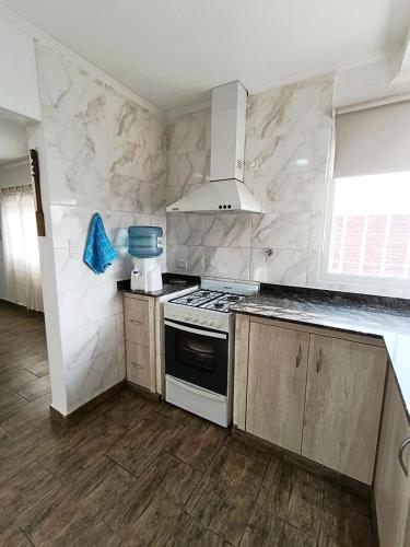 a kitchen with a stove and a sink at Cruz del Sur in Santa Rosa