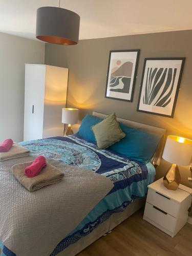 a bedroom with a bed with two pillows on it at Gorgeous GF 2 Bed 2 bathroom Apartment Liverpool 3 in Liverpool
