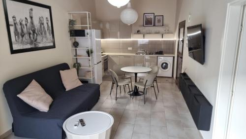 a small living room with a couch and a table at Historical Center Pretty House in Limassol