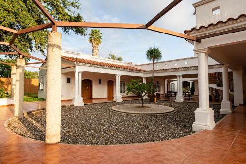 an exterior view of a house with a courtyard at Casa Ambito in San Raymundo Jalpan