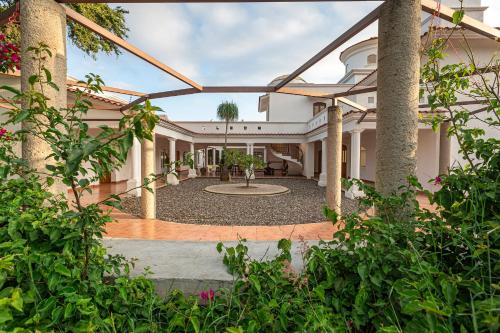 an exterior view of a house with a courtyard at Casa Ambito in San Raymundo Jalpan