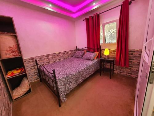Cama o camas de una habitación en wunderschöne Wohnung in Imi Ouaddar