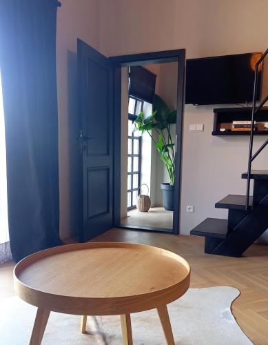 a room with a wooden table and a door at Villa Luna in Sedlec