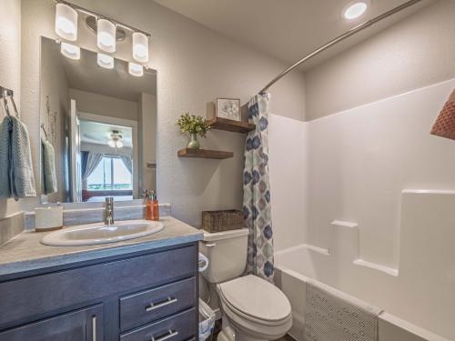 a bathroom with a sink and a toilet at Isaac's Nook in the Hills in Rapid City