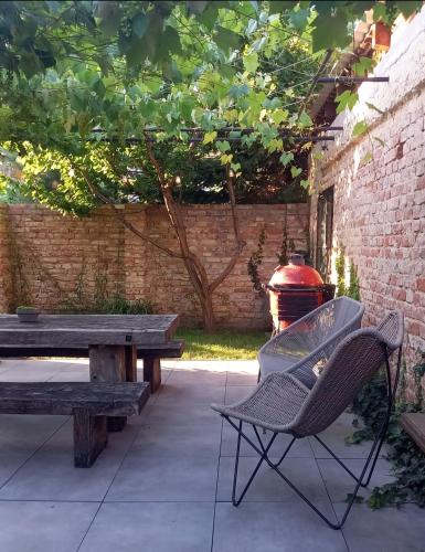 a patio with a picnic table and a grill at Villa Luna in Sedlec