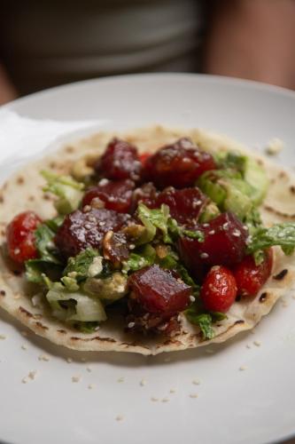 a tortilla with meat and vegetables on a plate at Rusteak Living Retreat in natural and peaceful setting in Canafistula in Cañafístula