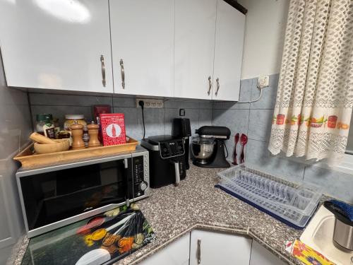 Dapur atau dapur kecil di Armonía y Tranquilidad