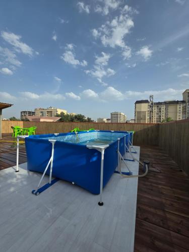 a blue table on top of a roof at Kushtar in Bishkek