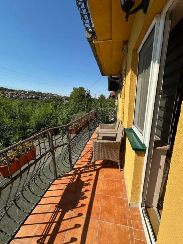 a balcony of a building with two benches on it at Vila Belilo in Sremski Karlovci