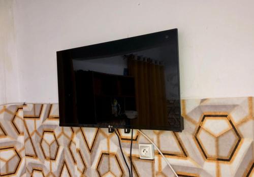 TV a/nebo společenská místnost v ubytování Cité des Anges