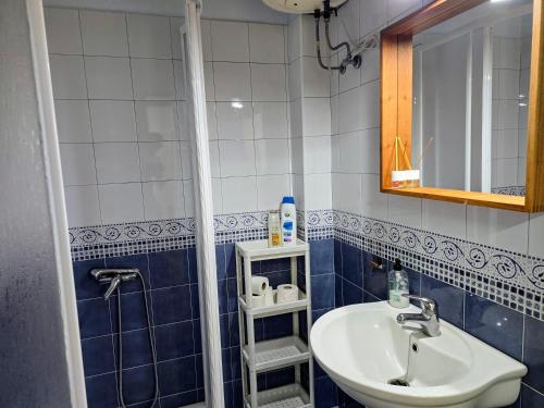 a bathroom with a sink and a shower at VV Casa Marire "by henrypole home" in Breña Alta