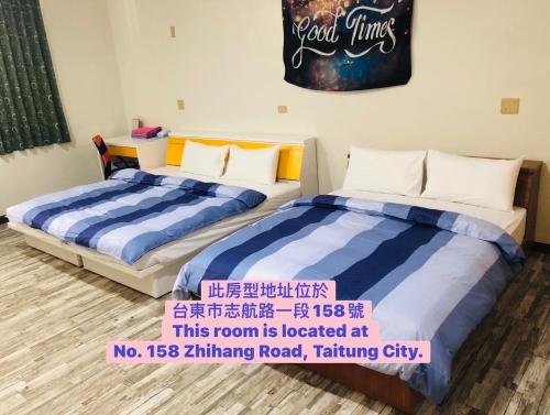 Cama o camas de una habitación en 暖暖旅宿