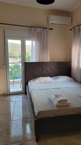 Ένα ή περισσότερα κρεβάτια σε δωμάτιο στο Sundive Apartments