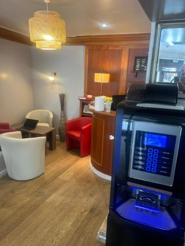a room with a room with a living room with a living room at Le Faidherbe Hotel Coeur de ville in Boulogne-sur-Mer
