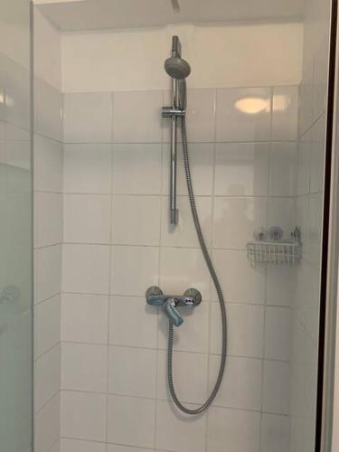 a shower with a shower head in a bathroom at Historique vieux port in Marseille