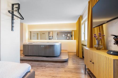 a large bathroom with a tub in a room at Urban Retreat Apartment - Whirpool - Top Lage in Cologne