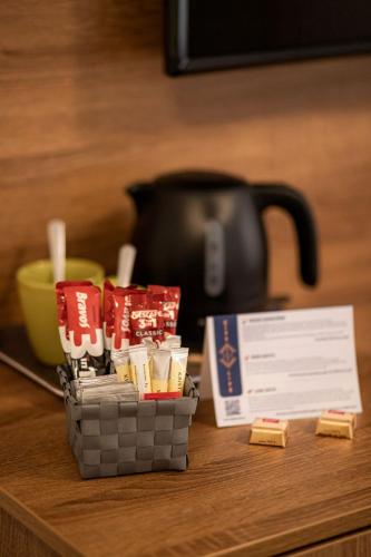 a basket of matches sitting on top of a table at Citylife Rooms in Mosonmagyaróvár