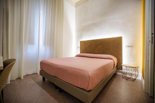 a bedroom with a bed and a window at Dimora Don Ciccillo B&B in Bagnara Calabra