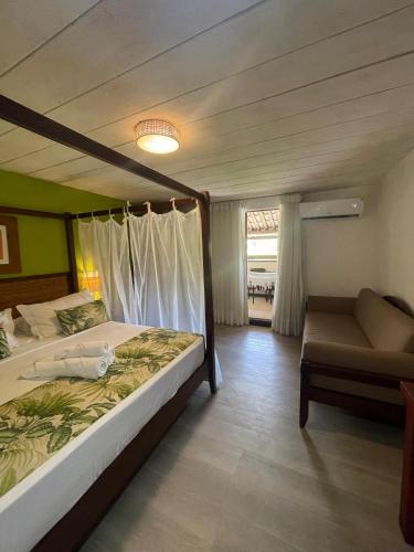 Postel nebo postele na pokoji v ubytování Sobrado da Vila Hotel