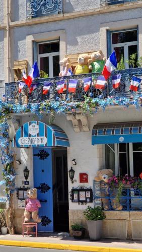 a group of teddy bears sitting on a balcony at Hotel ChezJeanne in La Bourboule