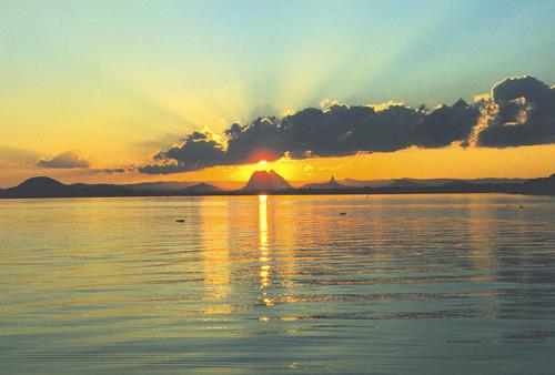 a sunset over a large body of water at Fairways Golf & Beach Retreat Bribie Island in Woorim