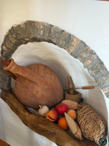 a painting of a turkey and vegetables on a wall at Vigliata Sidirounta Traditional Stonehouse in Chios
