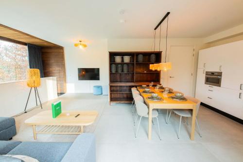 a living room with a dining table and a kitchen at Upscale 90m2 Two Bedroom Apartment - KS8B in Eindhoven