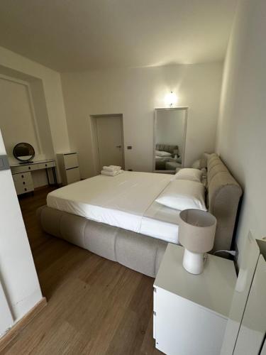 a bedroom with a large bed and a couch at Zoja 2 in Arona