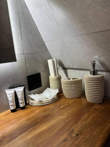 a group of three wicker baskets sitting on a wooden floor at Ariverev in Dilijan