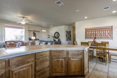 a kitchen with a large island in a living room at 2012 LP PS4, Private Balcony with Beautiful Mountain Views, and Great Clubhouse Amenities in St. George