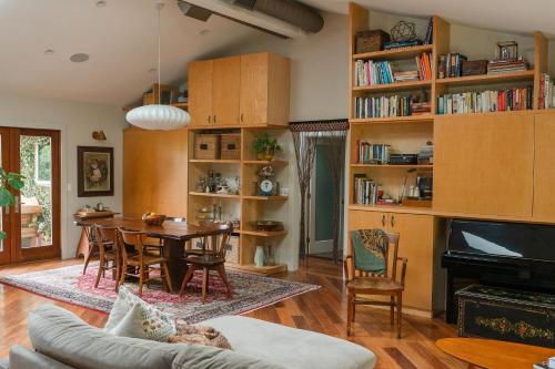 a living room with a table and a dining room at Casa Superba - Peaceful Sanctuary in Venice in Los Angeles