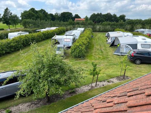 an aerial view of a group of tents and cars at Camping de Haarakker in Langeveen