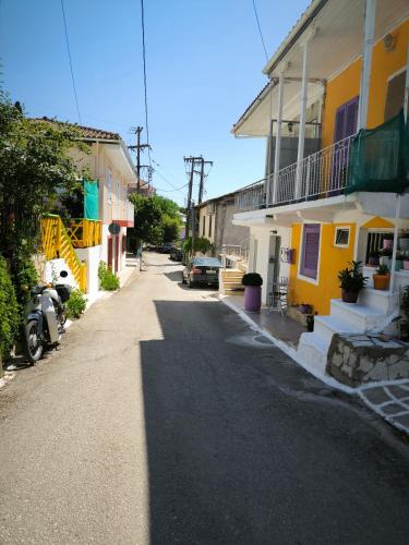 an empty street in a town with buildings at Deppy's House in Vasiliki