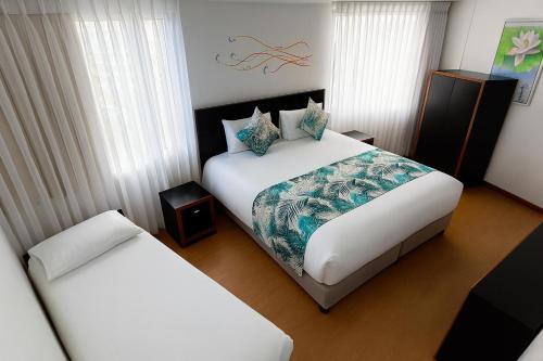 Postel nebo postele na pokoji v ubytování Benidorm Hotel