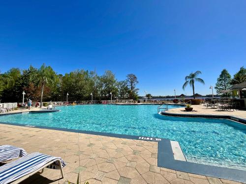 a swimming pool with blue water in a resort at Lake Views At Blue Heron in Orlando