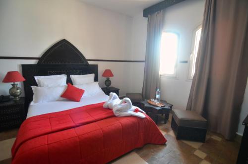 Ένα ή περισσότερα κρεβάτια σε δωμάτιο στο Hôtel Océan Vagabond