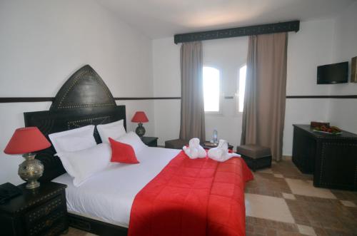 Ένα ή περισσότερα κρεβάτια σε δωμάτιο στο Hôtel Océan Vagabond