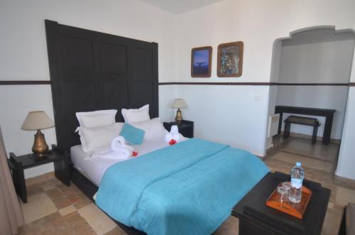 Ένα ή περισσότερα κρεβάτια σε δωμάτιο στο Hôtel Océan Vagabond