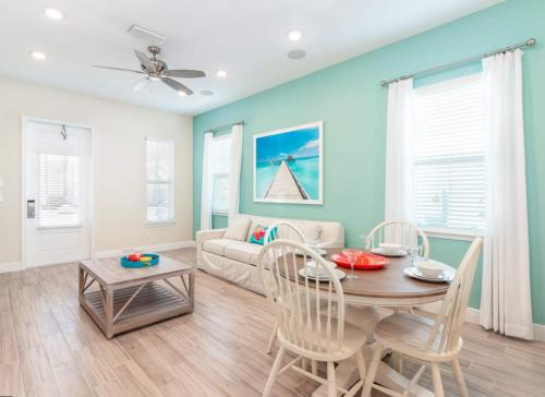 a living room with a table and a couch at Parrotfish Place - Stay for 6 in Orlando