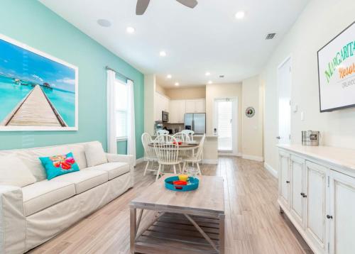 a living room with a couch and a table at Parrotfish Place - Stay for 6 in Orlando
