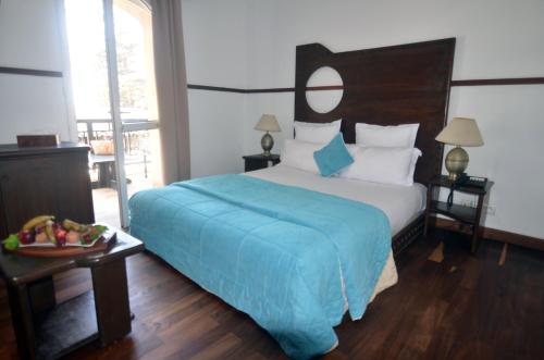 Ένα ή περισσότερα κρεβάτια σε δωμάτιο στο Hôtel Océan Vagabond