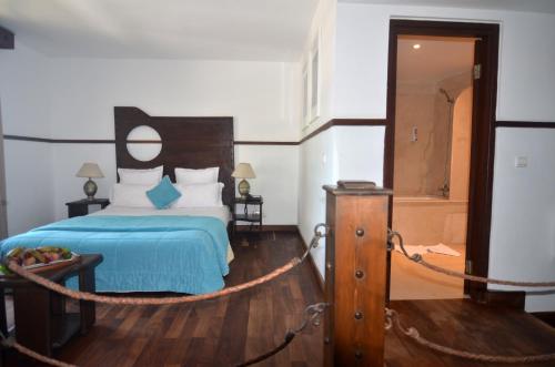 Ένα ή περισσότερα κρεβάτια σε δωμάτιο στο Hôtel Océan Vagabond