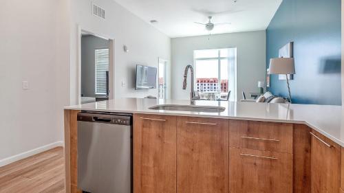 a kitchen with a sink and a counter top at Landing Incredible 1BD Pool Gym in Orlando